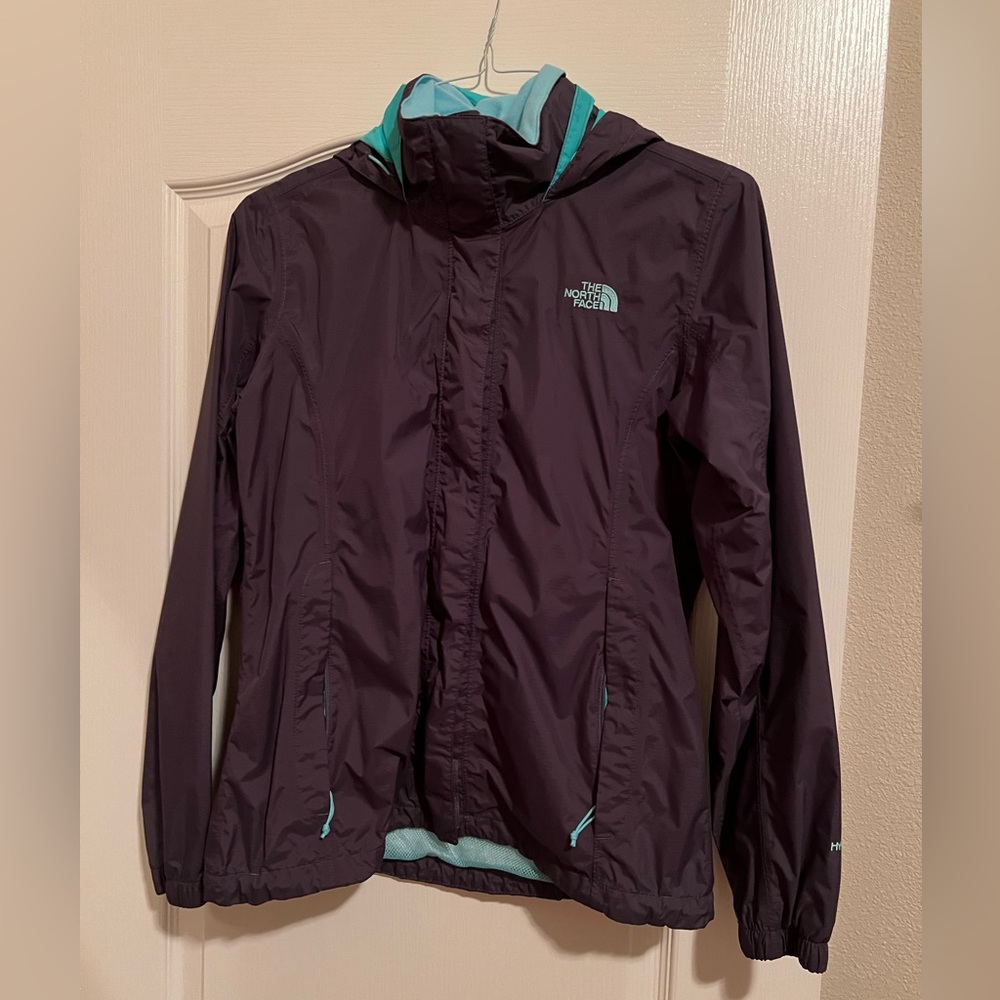 The Northface women’s medium Hyvent lightweight hooded jacket with mesh lining.